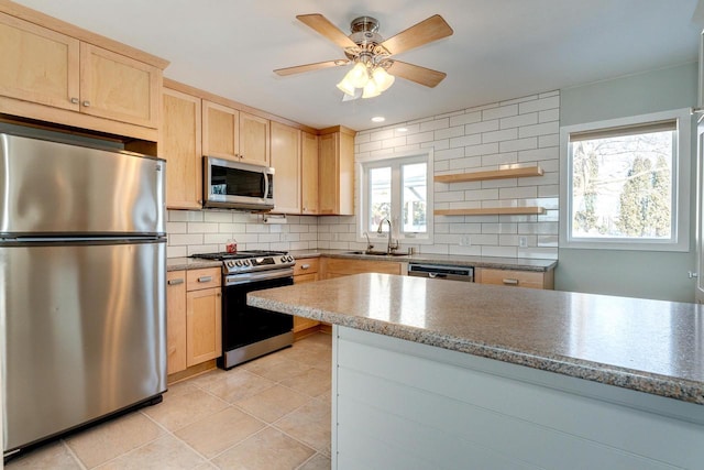 6592 Whalen Rd, Verona, WI 53593 - kitchen featuring appliances with stainless steel finishes, light brown cabinetry, and tasteful backsplash
