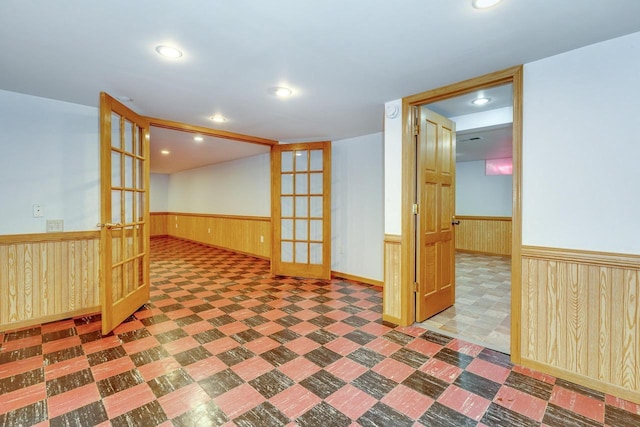 6592 Whalen Rd, Verona, WI 53593 - spare room featuring a wainscoted wall, tile patterned floors, wood walls, french doors, and recessed lighting