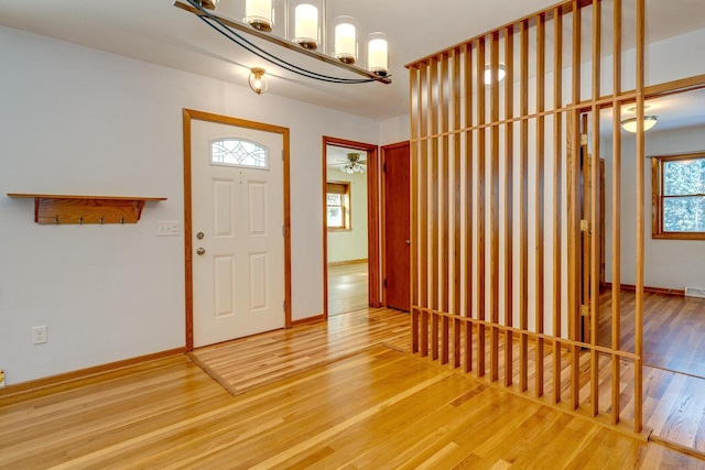 6592 Whalen Rd, Verona, WI 53593 - entrance foyer with wood finished floors and a chandelier
