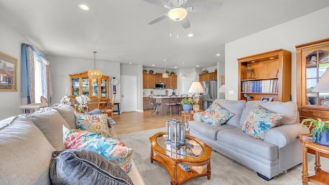 2824 Granite Ct, Sheboygan, WI 53081 - living room featuring healthy amount of natural light, ceiling fan, light wood finished floors, and recessed lighting