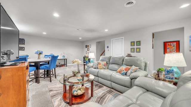 2824 Granite Ct, Sheboygan, WI 53081 - living room featuring light colored carpet, recessed lighting, and stairs