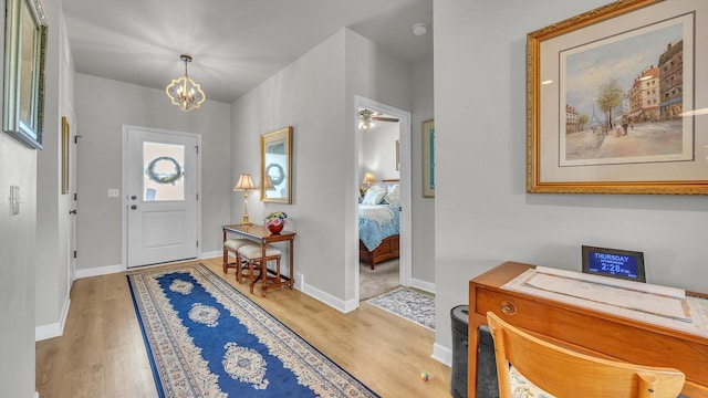 2824 Granite Ct, Sheboygan, WI 53081 - entryway featuring wood finished floors, a chandelier, and a ceiling fan