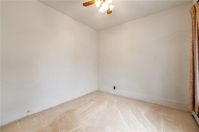 225 W Elm St, Chippewa Falls, WI 54729 - empty room with a ceiling fan, light colored carpet, and a baseboard radiator