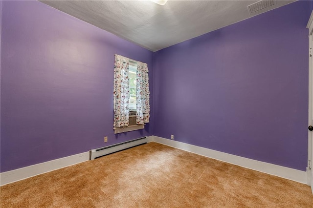 225 W Elm St, Chippewa Falls, WI 54729 - empty room featuring a baseboard radiator and carpet