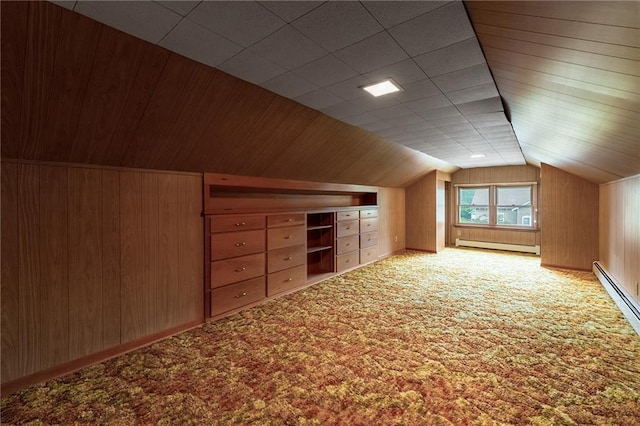 225 W Elm St, Chippewa Falls, WI 54729 - additional living space featuring a baseboard heating unit, carpet flooring, vaulted ceiling, and wooden walls