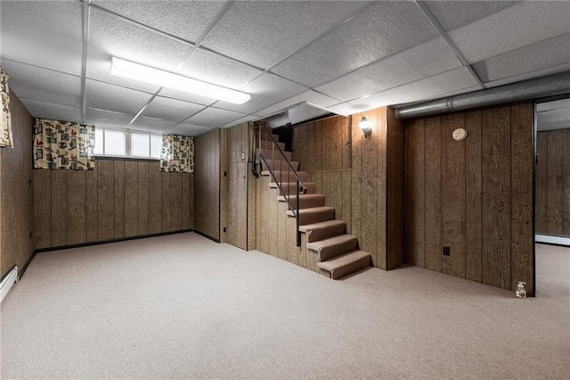 225 W Elm St, Chippewa Falls, WI 54729 - below grade area with wooden walls, carpet flooring, stairway, and a drop ceiling