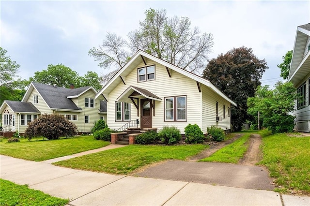225 W Elm St, Chippewa Falls, WI 54729 - view of front facade with a front yard