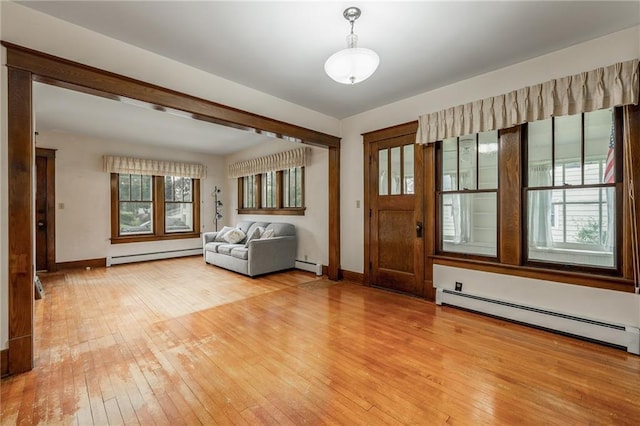225 W Elm St, Chippewa Falls, WI 54729 - foyer entrance with baseboard heating and light wood-style floors