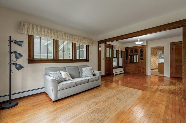 225 W Elm St, Chippewa Falls, WI 54729 - living room featuring a baseboard radiator and light wood-style flooring