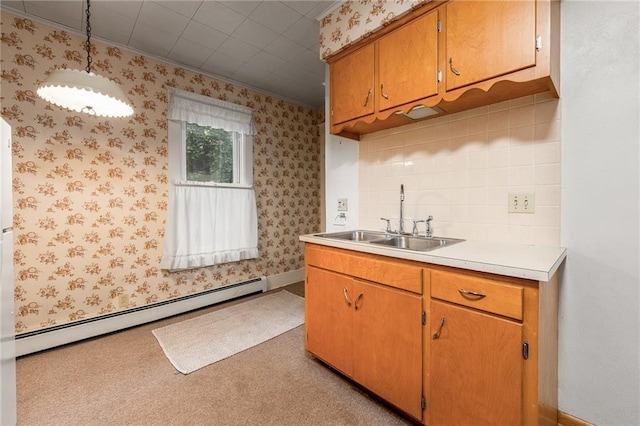 225 W Elm St, Chippewa Falls, WI 54729 - kitchen featuring baseboard heating, light countertops, decorative light fixtures, wallpapered walls, and ornamental molding
