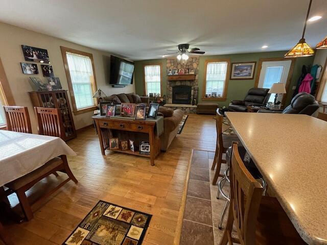 23826 18th St, Union Grove, WI 53182 - living room with a ceiling fan, a fireplace, light wood-style floors, and recessed lighting