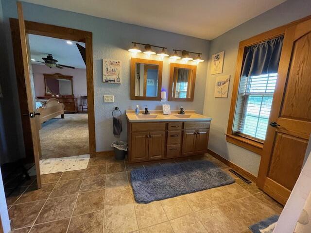 23826 18th St, Union Grove, WI 53182 - bathroom with double vanity and a ceiling fan