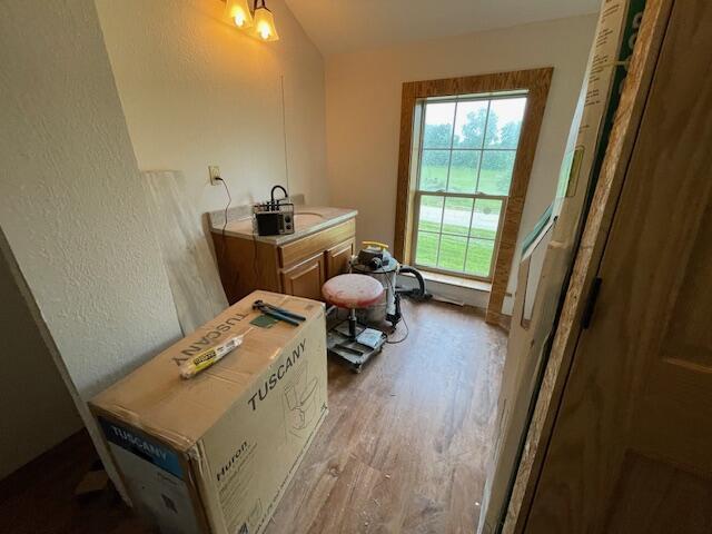 23826 18th St, Union Grove, WI 53182 - bathroom featuring wood finished floors and a textured wall