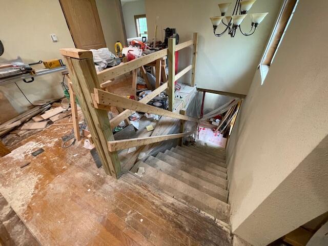 23826 18th St, Union Grove, WI 53182 - stairway featuring a chandelier
