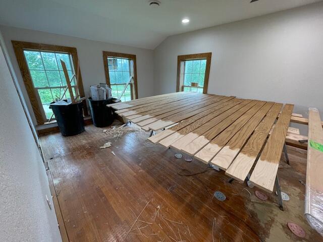 23826 18th St, Union Grove, WI 53182 - unfurnished bedroom featuring vaulted ceiling, wood finished floors, and recessed lighting