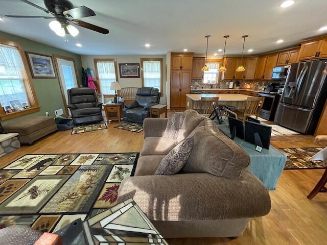 23826 18th St, Union Grove, WI 53182 - living room with light wood finished floors, a ceiling fan, and recessed lighting