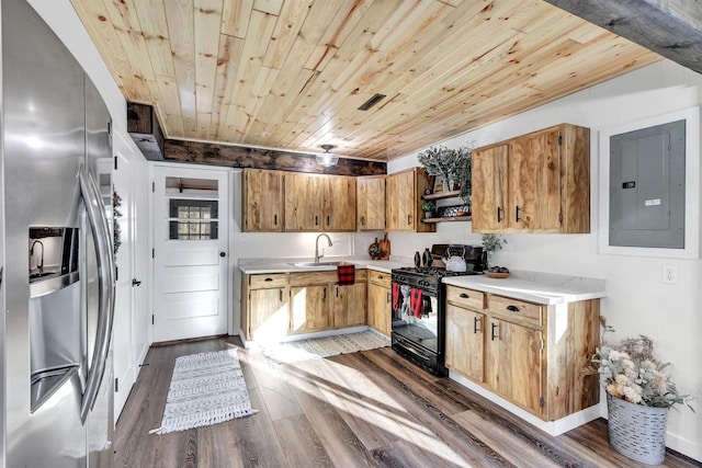 W9173 W 10th Rd, Pound, WI 54161 - kitchen featuring stainless steel fridge, black range with gas cooktop, electric panel, wood ceiling, and light countertops