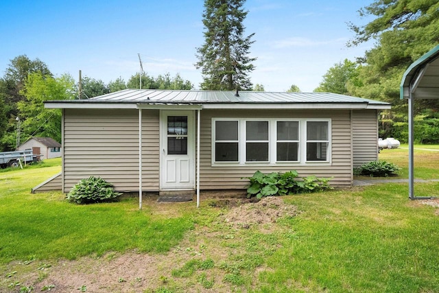 W9173 W 10th Rd, Pound, WI 54161 - back of house with a yard, a standing seam roof, and a metal roof