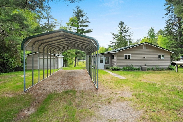 W9173 W 10th Rd, Pound, WI 54161 - view of green lawn featuring dirt driveway and a carport