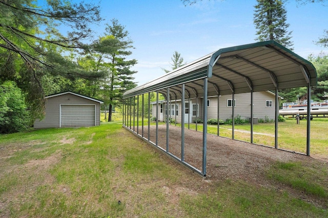 W9173 W 10th Rd, Pound, WI 54161 - view of grassy yard with an outdoor structure, a detached garage, and driveway