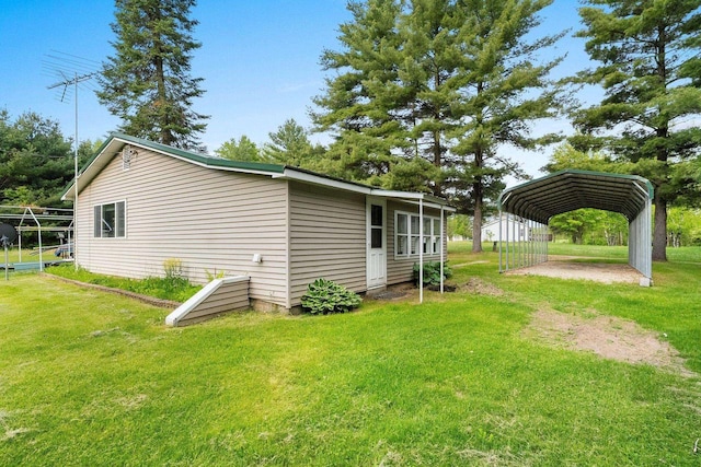 W9173 W 10th Rd, Pound, WI 54161 - view of property exterior featuring a carport and a lawn