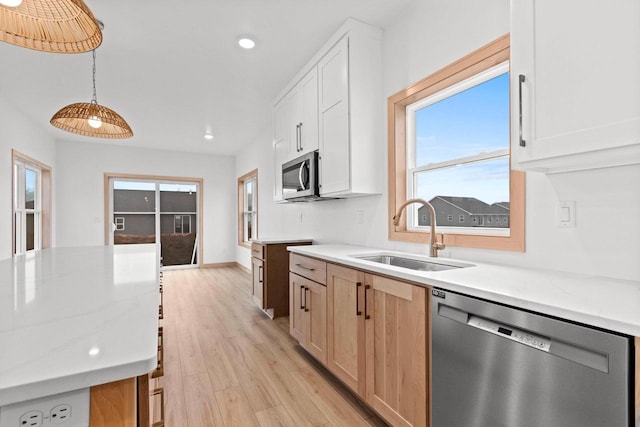399 Battery Ave, De Pere, WI 54115 - kitchen featuring appliances with stainless steel finishes, recessed lighting, light wood-style flooring, white cabinetry, and hanging light fixtures