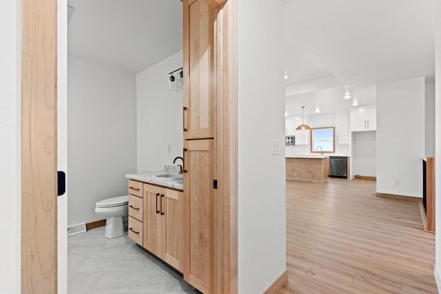 399 Battery Ave, De Pere, WI 54115 - bathroom with vanity, recessed lighting, and wood finished floors