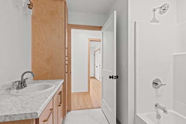 399 Battery Ave, De Pere, WI 54115 - bathroom featuring vanity, washtub / shower combination, and tile patterned flooring