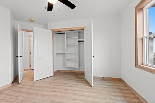399 Battery Ave, De Pere, WI 54115 - unfurnished bedroom featuring light wood finished floors, a closet, and ceiling fan