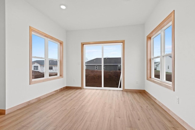 399 Battery Ave, De Pere, WI 54115 - spare room with light wood-type flooring, healthy amount of natural light, and recessed lighting