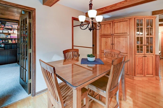 3590 Sabaka Trl, Verona, WI 53593 - dining space with light wood-style floors, a chandelier, and beamed ceiling