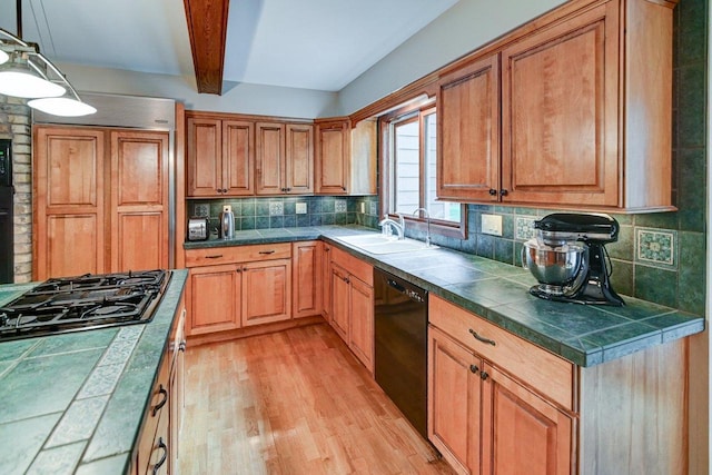 3590 Sabaka Trl, Verona, WI 53593 - kitchen featuring black appliances, backsplash, light wood-type flooring, beam ceiling, and tile counters
