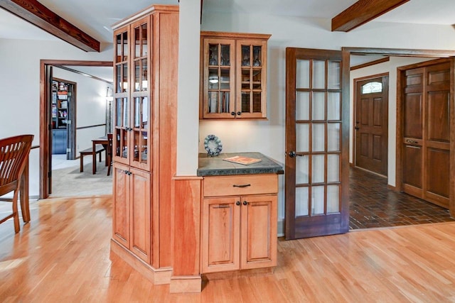 3590 Sabaka Trl, Verona, WI 53593 - bar area featuring beamed ceiling, light wood-style floors, and french doors