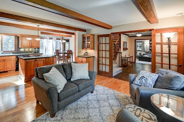 3590 Sabaka Trl, Verona, WI 53593 - living room with stairs, beamed ceiling, and light wood-type flooring