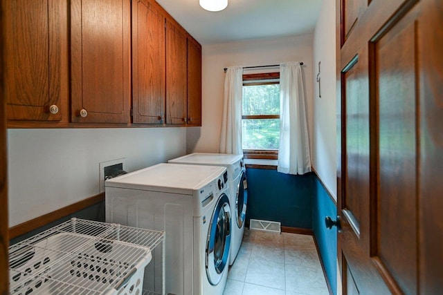 3590 Sabaka Trl, Verona, WI 53593 - laundry area featuring washer and clothes dryer and light tile patterned floors