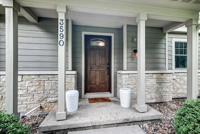 3590 Sabaka Trl, Verona, WI 53593 - entrance to property featuring stone siding and a porch