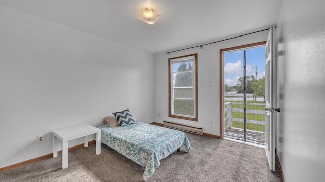 2408 Park Pl Unit D, Sheboygan, WI 53083 - carpeted bedroom with baseboard heating and access to exterior