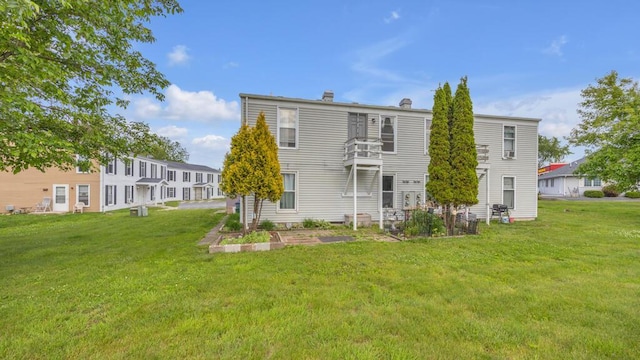2408 Park Pl Unit D, Sheboygan, WI 53083 - rear view of house with a lawn
