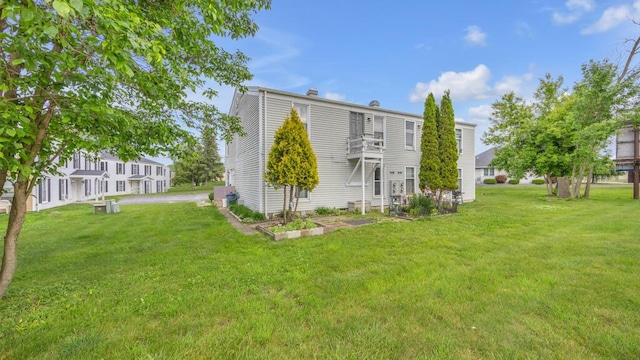 2408 Park Pl Unit D, Sheboygan, WI 53083 - back of house with a yard and a chimney