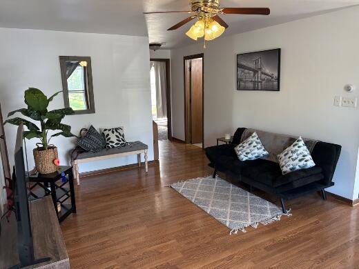 2408 Park Pl Unit D, Sheboygan, WI 53083 - living area featuring wood finished floors and ceiling fan