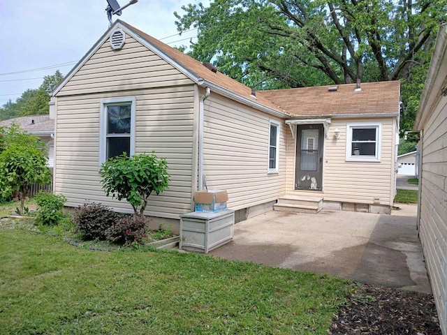1415 S Kernan St, Appleton, WI 54915 - rear view of house with a lawn and a patio area