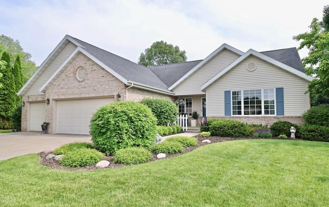 2360 Cobblestone Ln, Beloit, WI 53511 - ranch-style house with brick siding, an attached garage, a front lawn, concrete driveway, and a shingled roof