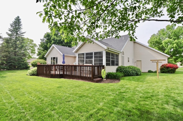 2360 Cobblestone Ln, Beloit, WI 53511 - back of house with a sunroom, a yard, and a deck