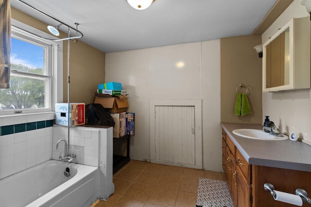 814 Quinney Ave, Kaukauna, WI 54130 - bathroom with vanity, a garden tub, and tile patterned flooring