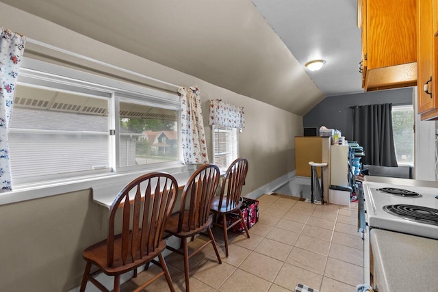 814 Quinney Ave, Kaukauna, WI 54130 - dining room with vaulted ceiling, light tile patterned flooring, and healthy amount of natural light