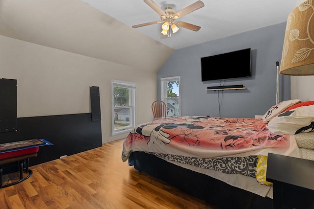 814 Quinney Ave, Kaukauna, WI 54130 - bedroom featuring wood finished floors, vaulted ceiling, and a ceiling fan