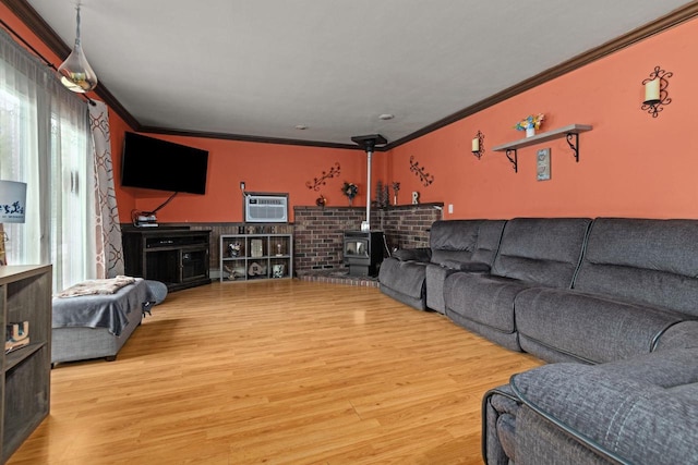 814 Quinney Ave, Kaukauna, WI 54130 - home theater room with ornamental molding, wood finished floors, a wall mounted air conditioner, and a wood stove