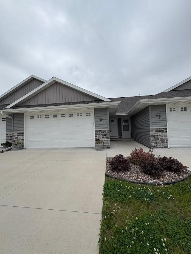 4842 N Marlo Way Unit 35, Appleton, WI 54913 - view of front of property with stone siding, concrete driveway, and board and batten siding