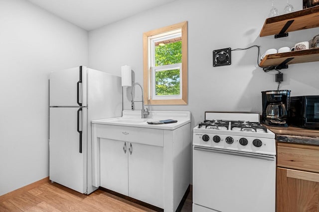 9347 Musky Bay Ln, Harshaw, WI 95429 - kitchen with white appliances, light wood-type flooring, and open shelves