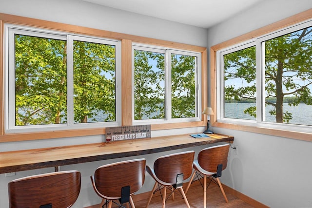 9347 Musky Bay Ln, Harshaw, WI 95429 - dining room with a water view and baseboards